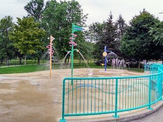 Playground with winding tube and regular green slides in Waverley, Guelph, Ontario