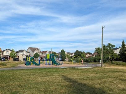 Playground shot from a distance and background residential homes in Kortright Hills, Guelph, Ontario